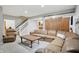 The living room features a spacious seating area, with carpeting throughout at 11974 Volcanic Rock Dr, Fishers, IN 46037