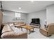 The living room offers a spacious seating area, carpeting, and a window at 11974 Volcanic Rock Dr, Fishers, IN 46037