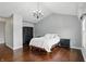 Comfortable main bedroom features hardwood floors, chandelier, and two dressers for storage at 11974 Volcanic Rock Dr, Fishers, IN 46037