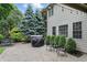 Charming patio area with a grill, outdoor seating, and meticulously maintained landscaping at 11974 Volcanic Rock Dr, Fishers, IN 46037