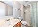 Cozy bathroom featuring a shower with curtains and a mirrored sink vanity at 12455 Deerview Dr, Noblesville, IN 46060