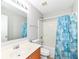 Bathroom featuring a single sink vanity, toilet, tub and shower with a curtain at 12455 Deerview Dr, Noblesville, IN 46060