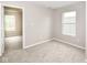 Bedroom featuring neutral walls, carpeted floor, and natural light from two windows at 12455 Deerview Dr, Noblesville, IN 46060