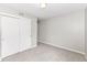 A simple bedroom with a built in closet, neutral walls, and carpeted floor at 12455 Deerview Dr, Noblesville, IN 46060