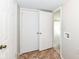 Hallway with tile flooring, closet, and view into a carpeted room at 12455 Deerview Dr, Noblesville, IN 46060