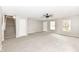 Bright living room features a ceiling fan and staircase at 12455 Deerview Dr, Noblesville, IN 46060