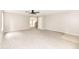 Spacious living room featuring plush carpeting and a ceiling fan at 12455 Deerview Dr, Noblesville, IN 46060