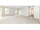 Bright living room with large windows and access to the bathroom at 12455 Deerview Dr, Noblesville, IN 46060