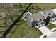 Aerial shot showcasing the home's manicured lawn and the fenced backyard at 1336 Danielle Rd, Lebanon, IN 46052