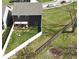 Aerial view of the backyard, highlighting the fire pit and white privacy fence at 1336 Danielle Rd, Lebanon, IN 46052