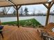 View of the backyard from the deck showing the fire pit and white vinyl privacy fence at 1336 Danielle Rd, Lebanon, IN 46052