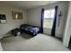 Bright bedroom with window, cozy bed, desk, and charming decor, creating a comfortable space at 1336 Danielle Rd, Lebanon, IN 46052