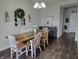 Bright dining room features a chandelier, large table, and decor, ideal for Gathering meals and entertaining guests at 1336 Danielle Rd, Lebanon, IN 46052