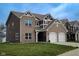 Attractive two-story home with a two-car garage, brick accents, and a well-maintained lawn at 1336 Danielle Rd, Lebanon, IN 46052