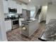 Bright kitchen featuring white cabinetry, stainless steel appliances, and a center island at 1336 Danielle Rd, Lebanon, IN 46052