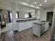 Modern kitchen with white cabinetry, granite countertops, and an open layout at 1336 Danielle Rd, Lebanon, IN 46052
