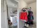 Well-lit laundry room with modern washer and dryer, shelving for supplies, and practical design at 1336 Danielle Rd, Lebanon, IN 46052
