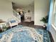 Cozy living area showcasing a stylish rug, comfortable seating, and ample natural light at 1336 Danielle Rd, Lebanon, IN 46052