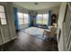 Inviting living room with hardwood floors, bright windows, and stylish blue accents at 1336 Danielle Rd, Lebanon, IN 46052
