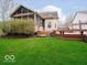 Backyard with a wooden deck and hot tub at 13921 Leatherwood Dr, Carmel, IN 46033