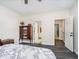 Spacious bedroom with neutral walls and hardwood floors, featuring doorways to other rooms at 13921 Leatherwood Dr, Carmel, IN 46033