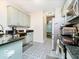 Modern kitchen with stylish cabinets, granite countertops, and stainless steel appliances at 13921 Leatherwood Dr, Carmel, IN 46033