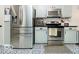 Well-equipped kitchen with stainless steel appliances, sleek countertops, and ample cabinet space at 13921 Leatherwood Dr, Carmel, IN 46033