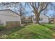 Lush backyard featuring a grill, storage, and a mature tree at 1441 N Euclid Ave, Indianapolis, IN 46201