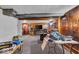 Finished basement featuring wood paneling, carpeting, and entertainment area with a fireplace and television at 1441 N Euclid Ave, Indianapolis, IN 46201