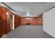 Basement area featuring ample space, wood paneling and drop ceiling at 1441 N Euclid Ave, Indianapolis, IN 46201