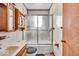 Bathroom features a tub and shower with tiled walls and a sink with cabinets at 1441 N Euclid Ave, Indianapolis, IN 46201