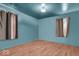 Comfortable bedroom with hardwood floors and neutral walls, perfect for personalization and relaxation at 1441 N Euclid Ave, Indianapolis, IN 46201