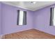 Bright bedroom with hardwood floors and natural light, a serene space to unwind and recharge at 1441 N Euclid Ave, Indianapolis, IN 46201