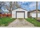 Exterior view of a detached garage with a gravel driveway and well-maintained lawn at 1441 N Euclid Ave, Indianapolis, IN 46201