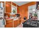 Well-lit kitchen with classic cabinetry and essential appliances, ready for culinary creations and everyday use at 1441 N Euclid Ave, Indianapolis, IN 46201