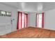 Bright living room with hardwood floors, ample natural light, and neutral decor, creating a welcoming space at 1441 N Euclid Ave, Indianapolis, IN 46201