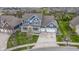 Aerial view of a blue two-story home showcasing a two-car garage, covered porch, and lush lawn at 14918 Dawnhaven Dr, Westfield, IN 46074