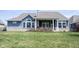 Beautiful backyard featuring lush lawn and a home's exterior with a covered patio at 14918 Dawnhaven Dr, Westfield, IN 46074