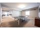 Large finished basement showcasing a ping pong table and other recreational areas at 14918 Dawnhaven Dr, Westfield, IN 46074