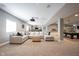 Finished basement with a large sectional sofa, and a custom wet bar in the background at 14918 Dawnhaven Dr, Westfield, IN 46074