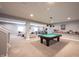 Spacious basement features a pool table, sitting area and custom wet bar with open layout at 14918 Dawnhaven Dr, Westfield, IN 46074