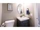 Charming half bath with modern vanity, oval mirror, and fresh paint at 14918 Dawnhaven Dr, Westfield, IN 46074
