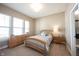 Cozy bedroom with a wood-framed bed, natural light from the window, and matching dressers at 14918 Dawnhaven Dr, Westfield, IN 46074