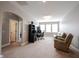 Spacious bonus room area with comfortable seating and a dedicated workspace with multiple monitors at 14918 Dawnhaven Dr, Westfield, IN 46074