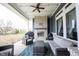 Covered patio with a brick fireplace, comfortable seating, and stylish decor at 14918 Dawnhaven Dr, Westfield, IN 46074