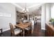 Open dining room with chandelier, hardwood floors and access to kitchen and living areas at 14918 Dawnhaven Dr, Westfield, IN 46074