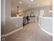 Upstairs hallway featuring carpet flooring, railing, and doors to various rooms at 14918 Dawnhaven Dr, Westfield, IN 46074