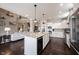 Spacious kitchen featuring granite countertops, a wine fridge, and stainless steel appliances at 14918 Dawnhaven Dr, Westfield, IN 46074