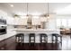 Bright kitchen featuring white cabinets, a large island, modern fixtures, and stainless steel appliances at 14918 Dawnhaven Dr, Westfield, IN 46074