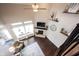Bright living room with a stone fireplace, high ceilings, and large windows for natural light at 14918 Dawnhaven Dr, Westfield, IN 46074